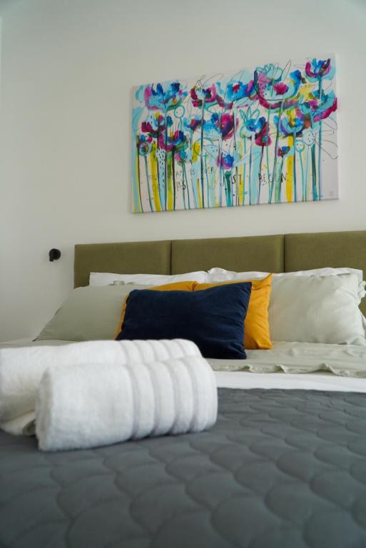 Bright bedroom with colourful cushions