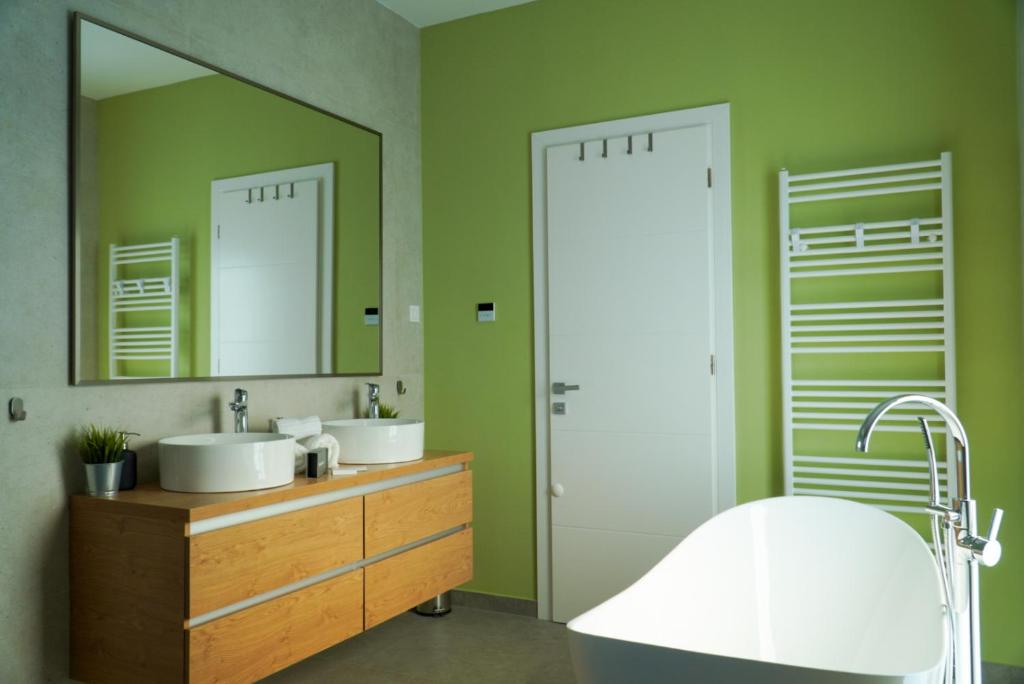 Bright bathroom with a bath and double vanity