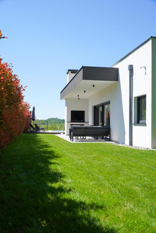 Covered garden terrace along the villa