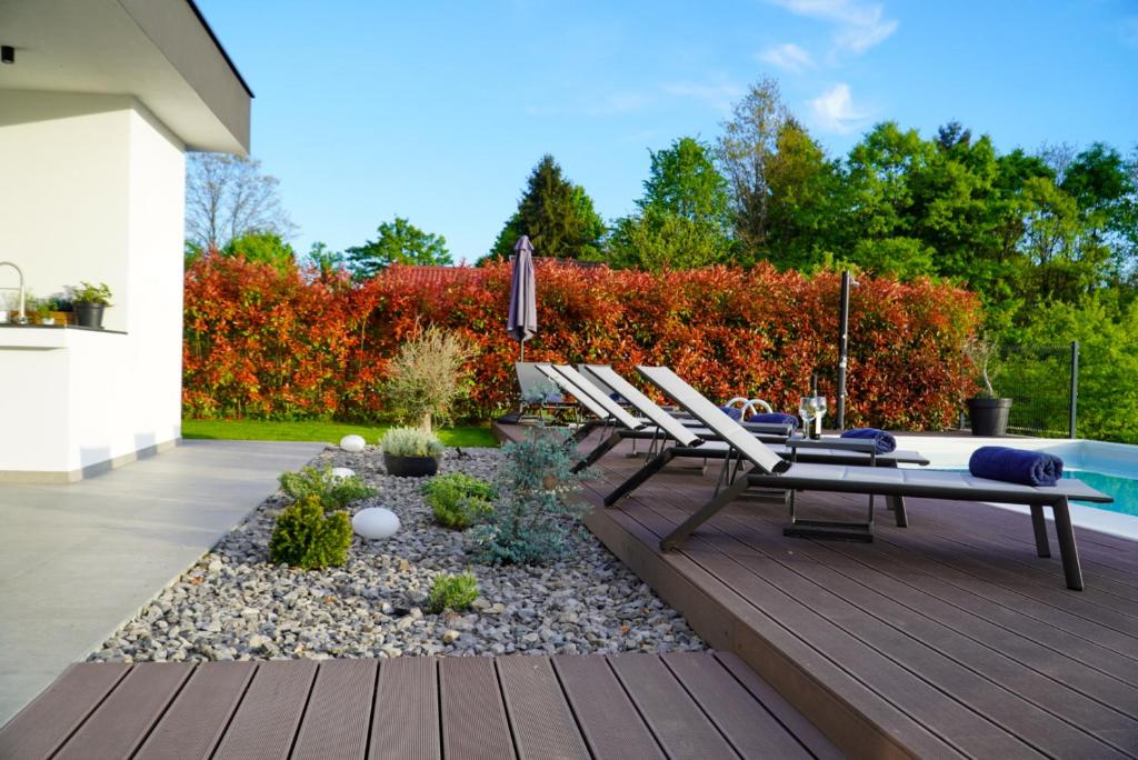 Sun loungers beside the landscaped pool terrace