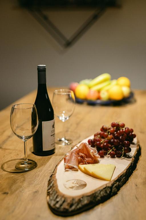 Wine, glasses and a fruit platter